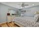 Light and airy bedroom with a ceiling fan and large windows at 19505 Coachlight Way, Lutz, FL 33549