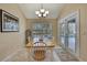 Bright dining area with table and chairs, pool view at 19505 Coachlight Way, Lutz, FL 33549