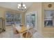 Bright dining area with french doors leading to the pool at 19505 Coachlight Way, Lutz, FL 33549