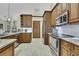 Updated kitchen with stainless steel appliances and granite at 19505 Coachlight Way, Lutz, FL 33549