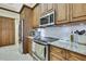 Modern kitchen with stainless steel appliances and granite countertops at 19505 Coachlight Way, Lutz, FL 33549