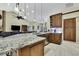 Modern kitchen with stainless steel appliances and granite countertops at 19505 Coachlight Way, Lutz, FL 33549