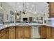 Large kitchen island with granite countertops and breakfast bar at 19505 Coachlight Way, Lutz, FL 33549