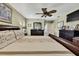 Main bedroom with king bed, hardwood floors, and ensuite bath access at 19505 Coachlight Way, Lutz, FL 33549