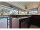 Granite countertop wet bar with fridge at 19505 Coachlight Way, Lutz, FL 33549