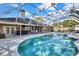 Inviting screened pool with patio furniture at 19505 Coachlight Way, Lutz, FL 33549