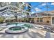 Relaxing pool and spa with covered patio at 19505 Coachlight Way, Lutz, FL 33549