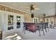 Covered patio features a wet bar with seating at 19505 Coachlight Way, Lutz, FL 33549