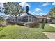 Expansive screened porch, perfect for outdoor relaxation at 19505 Coachlight Way, Lutz, FL 33549