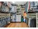Large walk-in closet with ample shelving and hanging space at 19505 Coachlight Way, Lutz, FL 33549