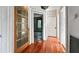 Hallway with wood floors and vintage-style doors at 322 S Plant Ave, Tampa, FL 33606