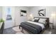 Bedroom with gray bedding and large window, offering natural light at 32746 Osprey Peak Way, San Antonio, FL 33576