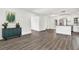 Open concept dining area with wood-look flooring and kitchen island at 4916 Carlyle Rd, Tampa, FL 33615