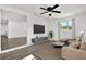 Spacious living room with plush seating and a large TV at 4916 Carlyle Rd, Tampa, FL 33615