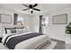 Serene main bedroom with a comfortable king-size bed and ample natural light at 4916 Carlyle Rd, Tampa, FL 33615