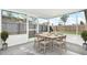 Spacious screened patio with backyard view, perfect for outdoor dining at 4916 Carlyle Rd, Tampa, FL 33615