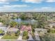 Aerial view of a house near a lake, showcasing the property and surrounding neighborhood at 5269 61St N Way, Kenneth City, FL 33709