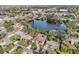 Aerial view of a house near a lake, showcasing the property and surrounding neighborhood at 5269 61St N Way, Kenneth City, FL 33709