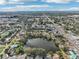 Aerial view showing home's location near a lake in a residential area at 5269 61St N Way, Kenneth City, FL 33709