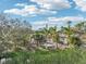 Backyard of the house with palm trees and a partial view of the lake at 5269 61St N Way, Kenneth City, FL 33709