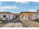 Large backyard with covered patio and a brick paved area at 5269 61St N Way, Kenneth City, FL 33709