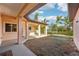 Spacious backyard with covered patio, overlooking a tranquil lake at 5269 61St N Way, Kenneth City, FL 33709