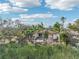 Backyard view showcasing a house with palm trees at 5269 61St N Way, Kenneth City, FL 33709