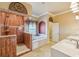 Elegant bathroom with double sinks, soaking tub, and walk-in shower at 5269 61St N Way, Kenneth City, FL 33709