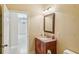 Bathroom with vanity, toilet, and view into another room at 5269 61St N Way, Kenneth City, FL 33709