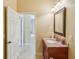 Small bathroom with vanity and view of hallway at 5269 61St N Way, Kenneth City, FL 33709