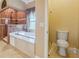 Bathroom with toilet and walk-in shower at 5269 61St N Way, Kenneth City, FL 33709