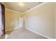 Simple bedroom with tile flooring and an additional door at 5269 61St N Way, Kenneth City, FL 33709