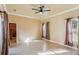 Large bedroom with ceiling fan, tile floors, and ample closet space at 5269 61St N Way, Kenneth City, FL 33709