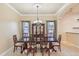 Elegant dining room with a large table and hutch at 5269 61St N Way, Kenneth City, FL 33709