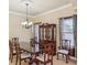 Elegant dining room with a large table and hutch at 5269 61St N Way, Kenneth City, FL 33709