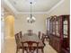 Formal dining room with large table, chandelier, and built-in hutch at 5269 61St N Way, Kenneth City, FL 33709