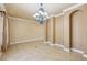 Spacious dining room featuring tile floors and elegant chandelier at 5269 61St N Way, Kenneth City, FL 33709