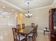 Elegant dining room with chandelier and hardwood table at 5269 61St N Way, Kenneth City, FL 33709