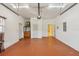 Spacious garage with painted floor, storage, and access door at 5269 61St N Way, Kenneth City, FL 33709