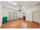 Garage with overhead door, storage, and side door at 5269 61St N Way, Kenneth City, FL 33709