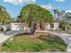 House exterior with circular driveway and mature landscaping at 5269 61St N Way, Kenneth City, FL 33709
