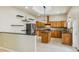 Modern kitchen with wood cabinets, granite countertops, and stainless steel appliances at 5269 61St N Way, Kenneth City, FL 33709