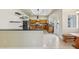 Eat-in kitchen with breakfast bar, wood cabinets, and granite countertops at 5269 61St N Way, Kenneth City, FL 33709