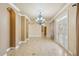 Bright and airy living room featuring tile floors and a decorative chandelier at 5269 61St N Way, Kenneth City, FL 33709
