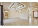 Spacious living room with tray ceiling, recessed lighting, and tile flooring at 5269 61St N Way, Kenneth City, FL 33709