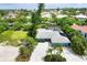 Bird's eye view of a light blue house, situated in a neighborhood near the water at 616 Lyons Ln, Longboat Key, FL 34228