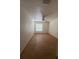 This spacious bedroom features tile floors, a ceiling fan, and a window for natural light at 6177 Chesham Dr # 6, New Port Richey, FL 34653
