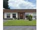 Charming single-story condo with well-maintained lawn and neutral exterior paint at 6177 Chesham Dr # 6, New Port Richey, FL 34653