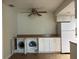 Laundry area with a washer, dryer, cabinets, and a countertop at 6177 Chesham Dr # 6, New Port Richey, FL 34653