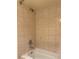Shower stall in bathroom featuring full tile surround at 6177 Chesham Dr # 6, New Port Richey, FL 34653